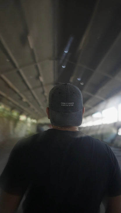 "Crib Studios" Black cap acid washed